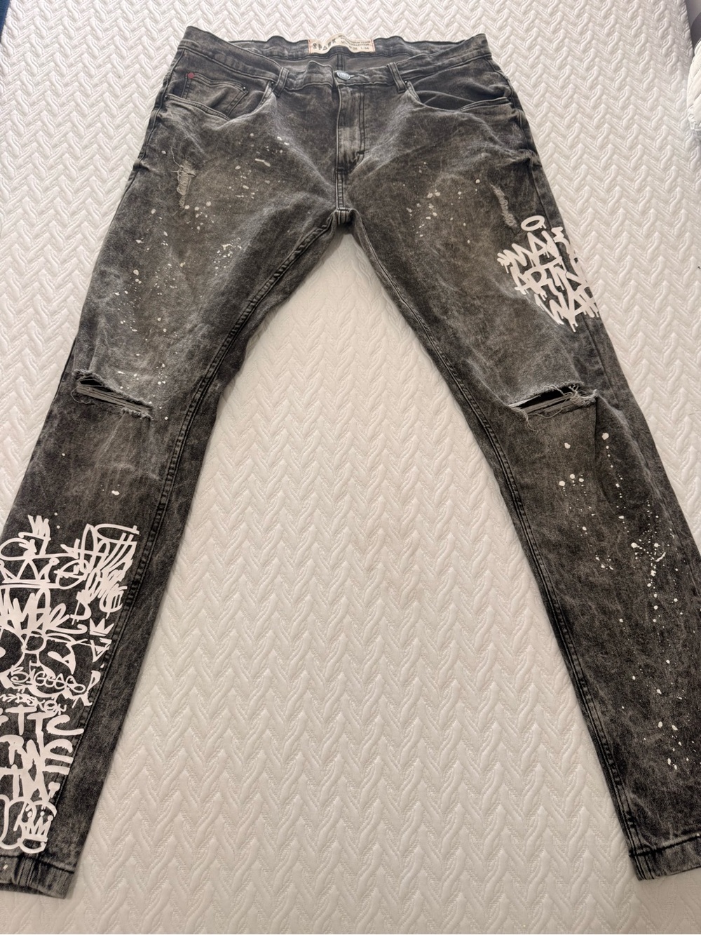 Slim Black Distressed Men's Jeans with White Graphic Accents